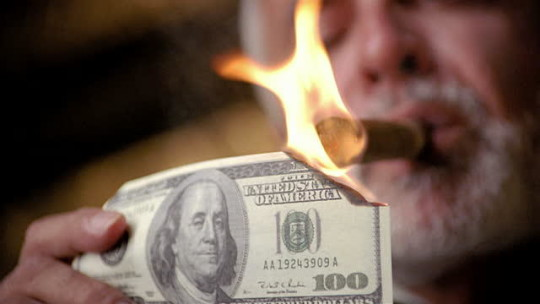 Lighting a Cigar with a 100 Dollar Bill